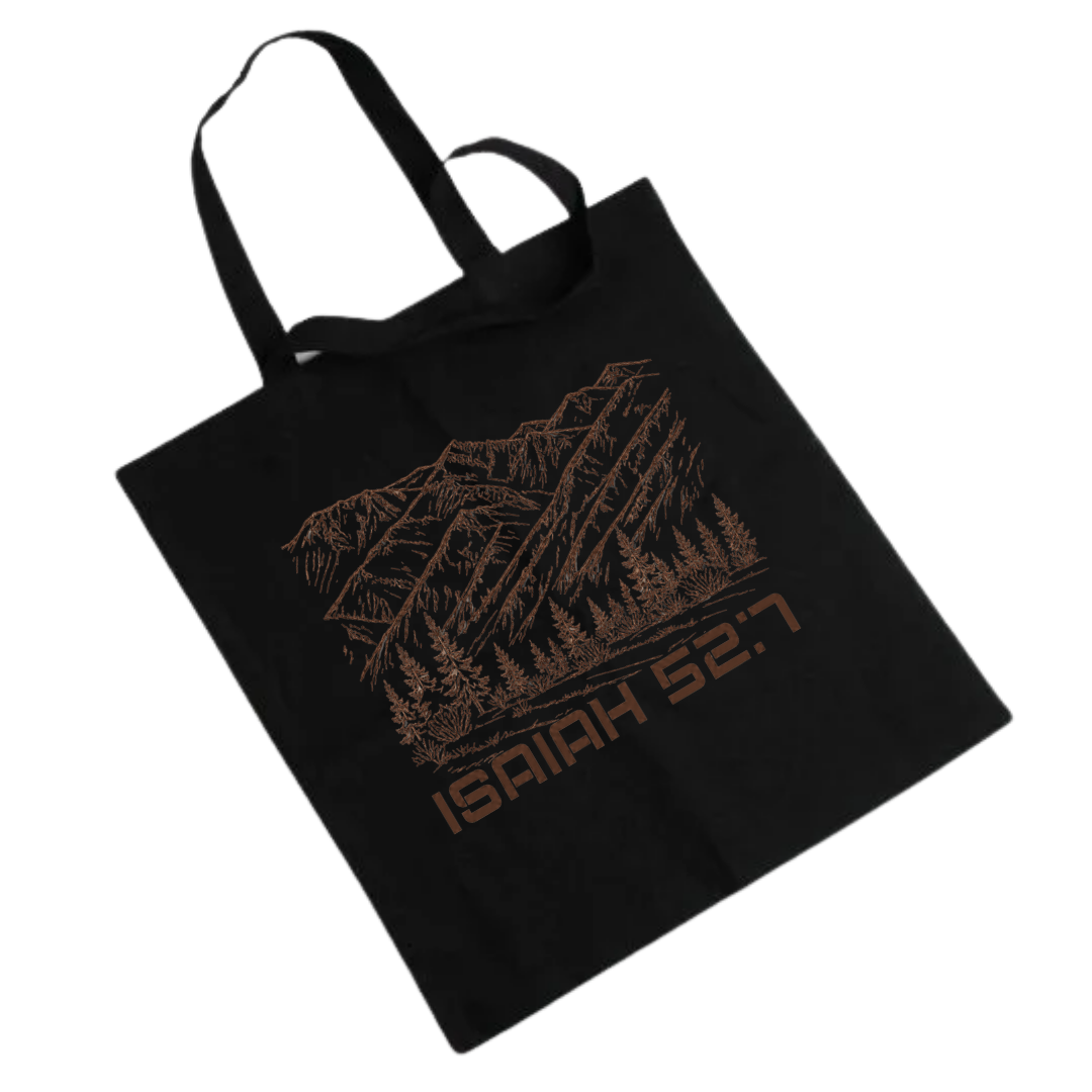 Black Tote featuring Montana Mountain Scene with Scripture Isaiah 52:7 under scene in brown font