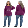 Woman wearing a purple long-sleeve shirt with text and blue jeans, shown from front and back on a white background.